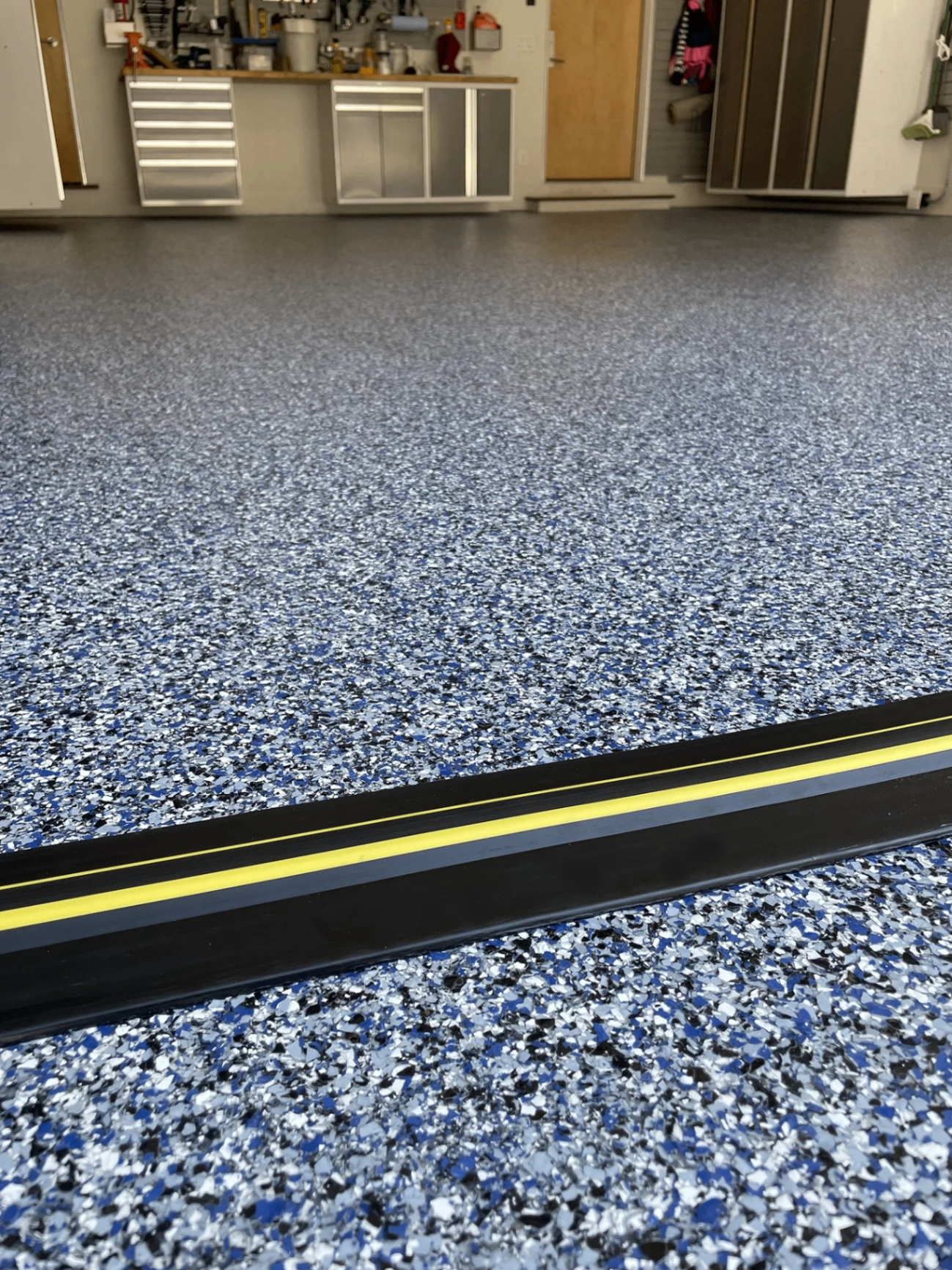 Close-up of a decorative flake epoxy floor finish