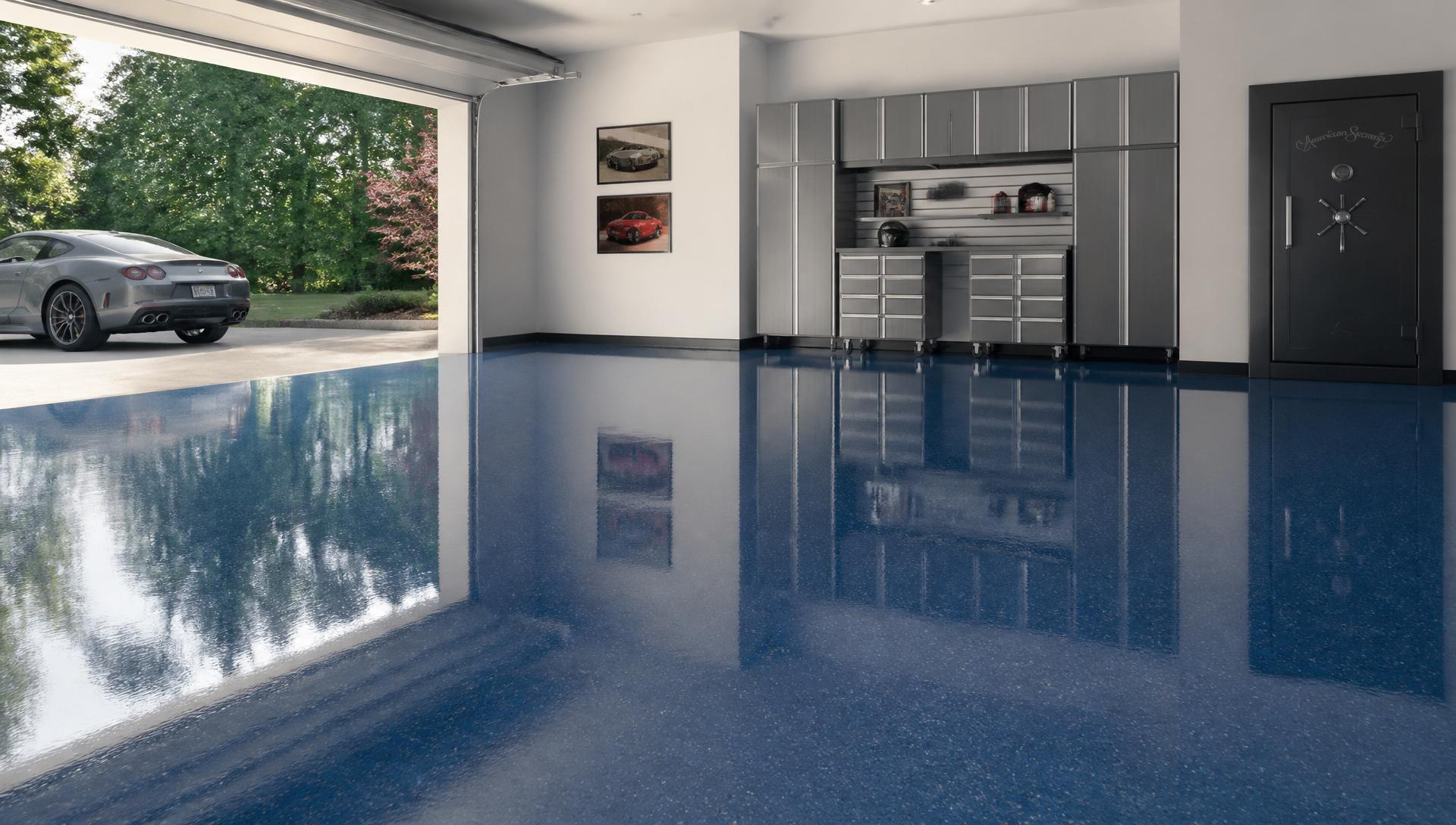Premium residential garage with glossy deep blue epoxy flooring